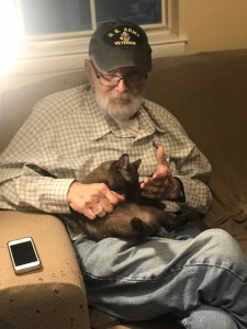Retired Veteran holding Burmese cat Carmelkats 